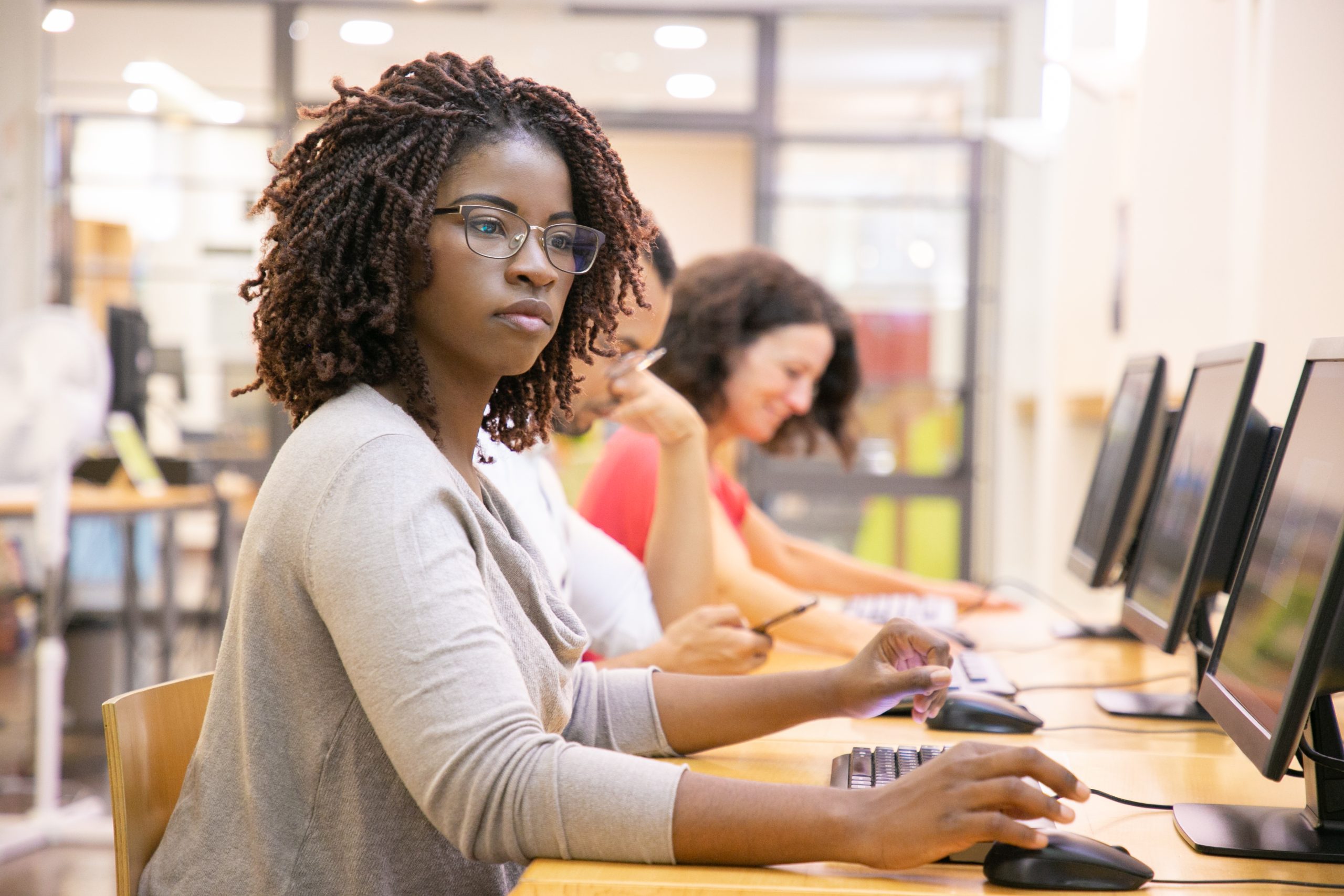 black-woman-adult-student-working-in-computer-class-scaled.jpg