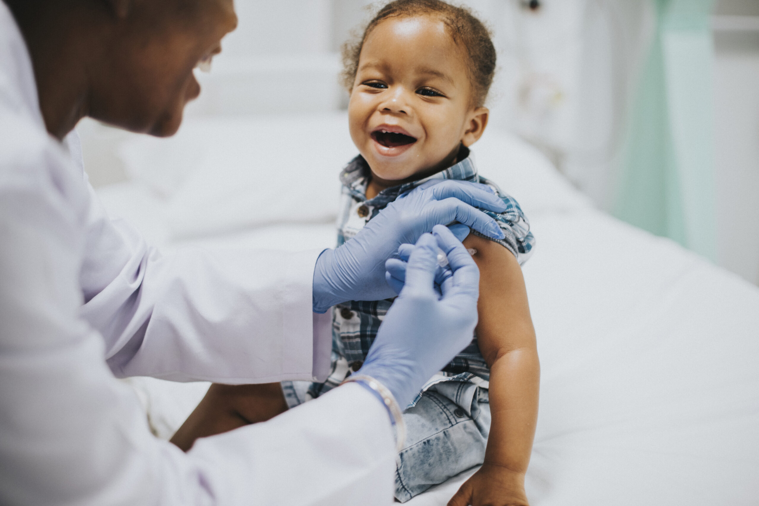 toddler-getting-a-vaccination-by-a-pediatrician-scaled-1.jpg