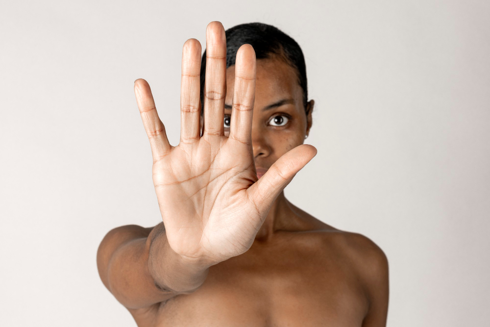 bare-chested-black-woman-doing-stop-hand-gesture.jpg