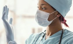 close-up-health-worker-with-gloves-scaled.jpg